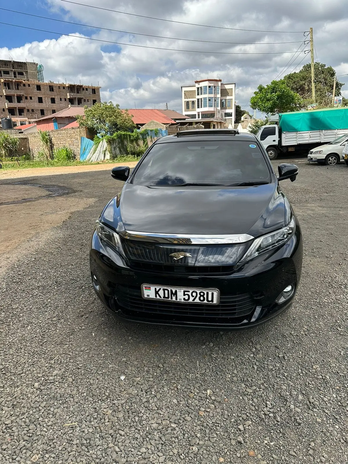 Black Toyota Harrier premium SUV photographed from the front