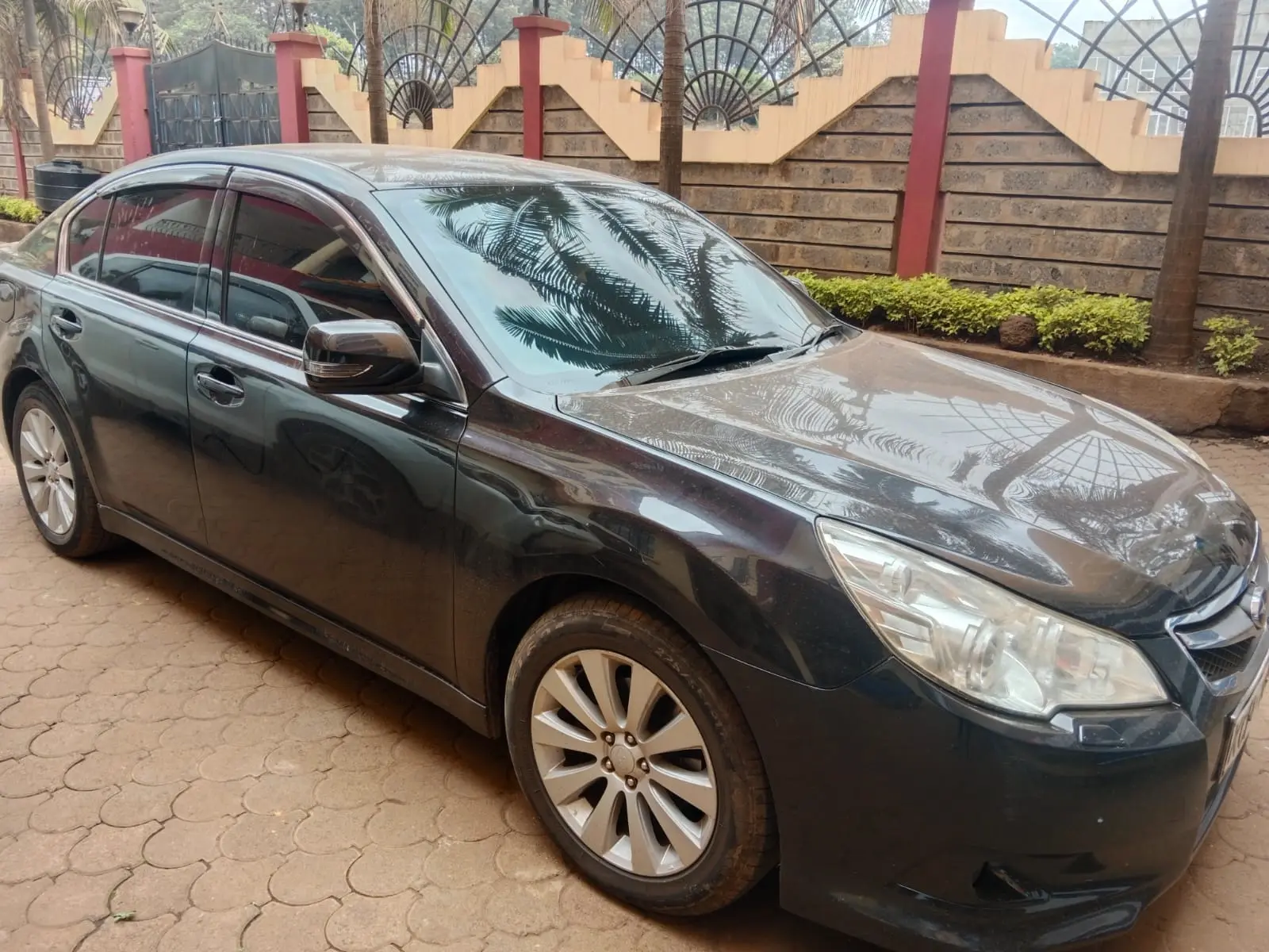 Graphite Subaru Legacy executive saloon photographed from the front side